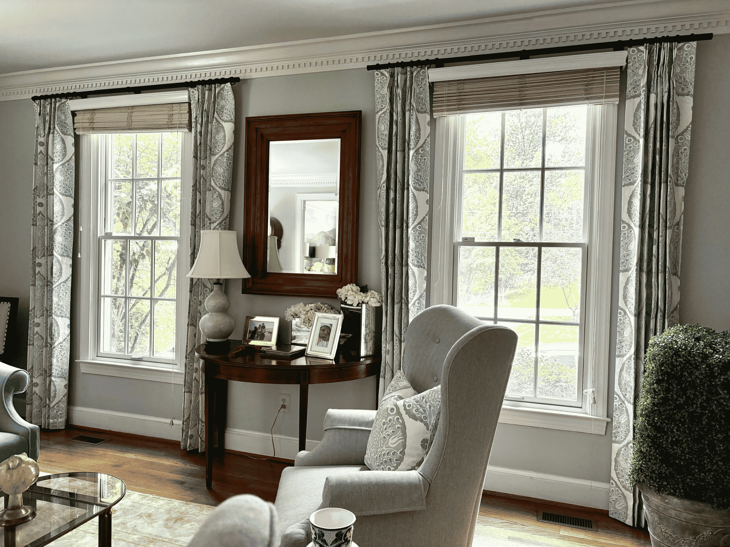 Primary bedroom with patterned floor-length drapery
