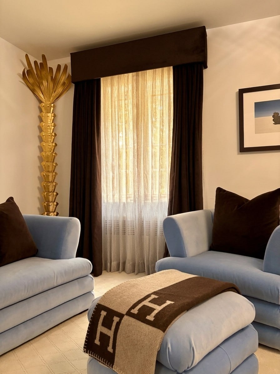 Primary bedroom with patterned floor-length drapery