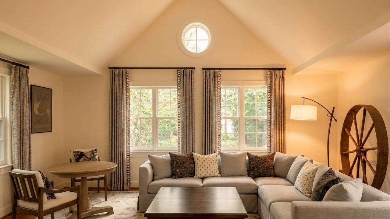 Floor-to-ceiling glass with sheer ripple-fold curtains